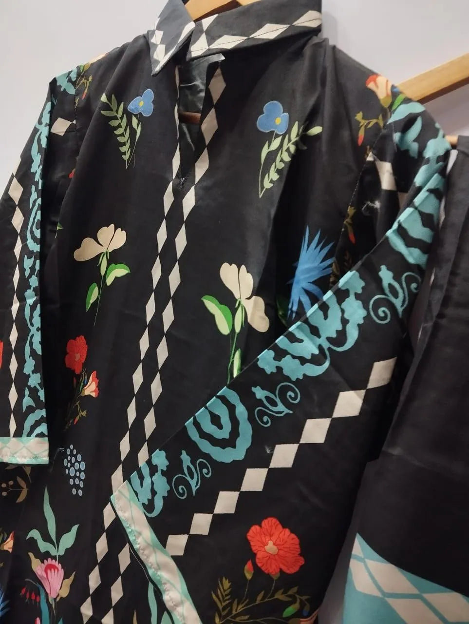 Black digital printed Pakistani kurta set for women in Swiss lawn fabric with embroidered shirt and matching trouser.