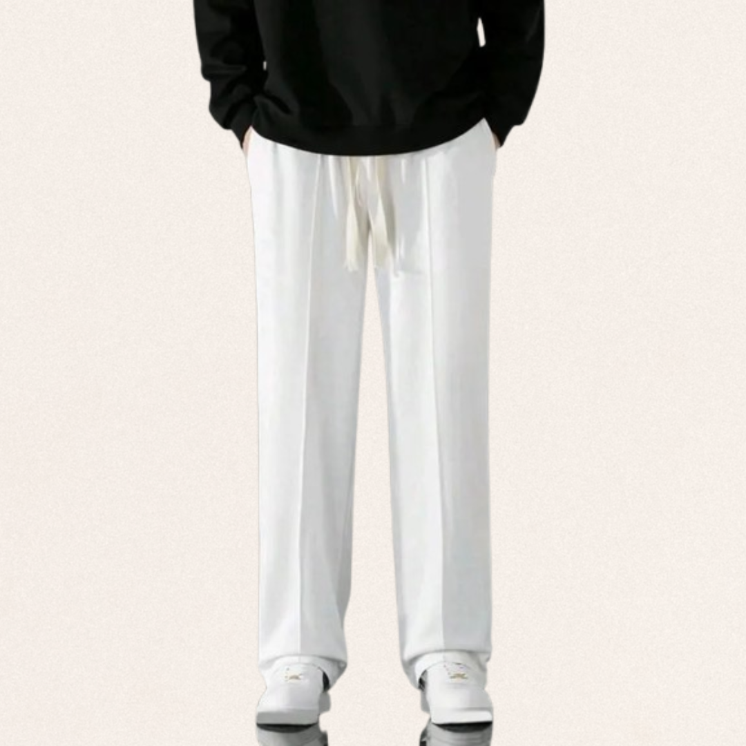 Men's Dri-Fit sports trousers in black, blue, and white colors for gym workouts and activewear fashion.
