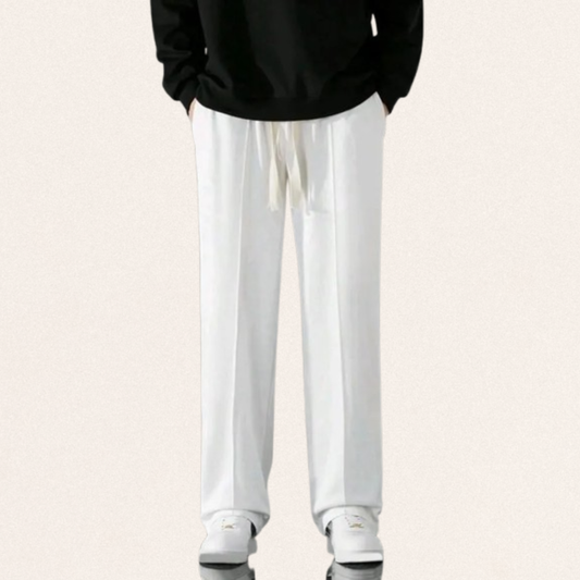 Men's Dri-Fit sports trousers in black, blue, and white colors for gym workouts and activewear fashion.