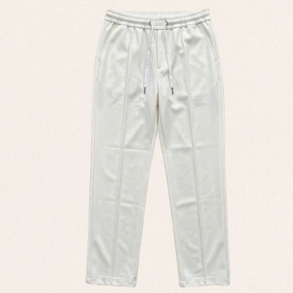 Men's Dri-Fit sports trousers in black, blue, and white colors for gym workouts and activewear fashion.