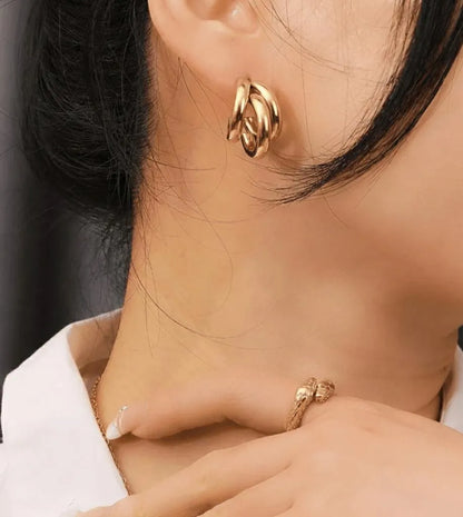 Golden three-layer Korean style hoop earrings for women made of lightweight alloy for casual and festive jewelry wear.