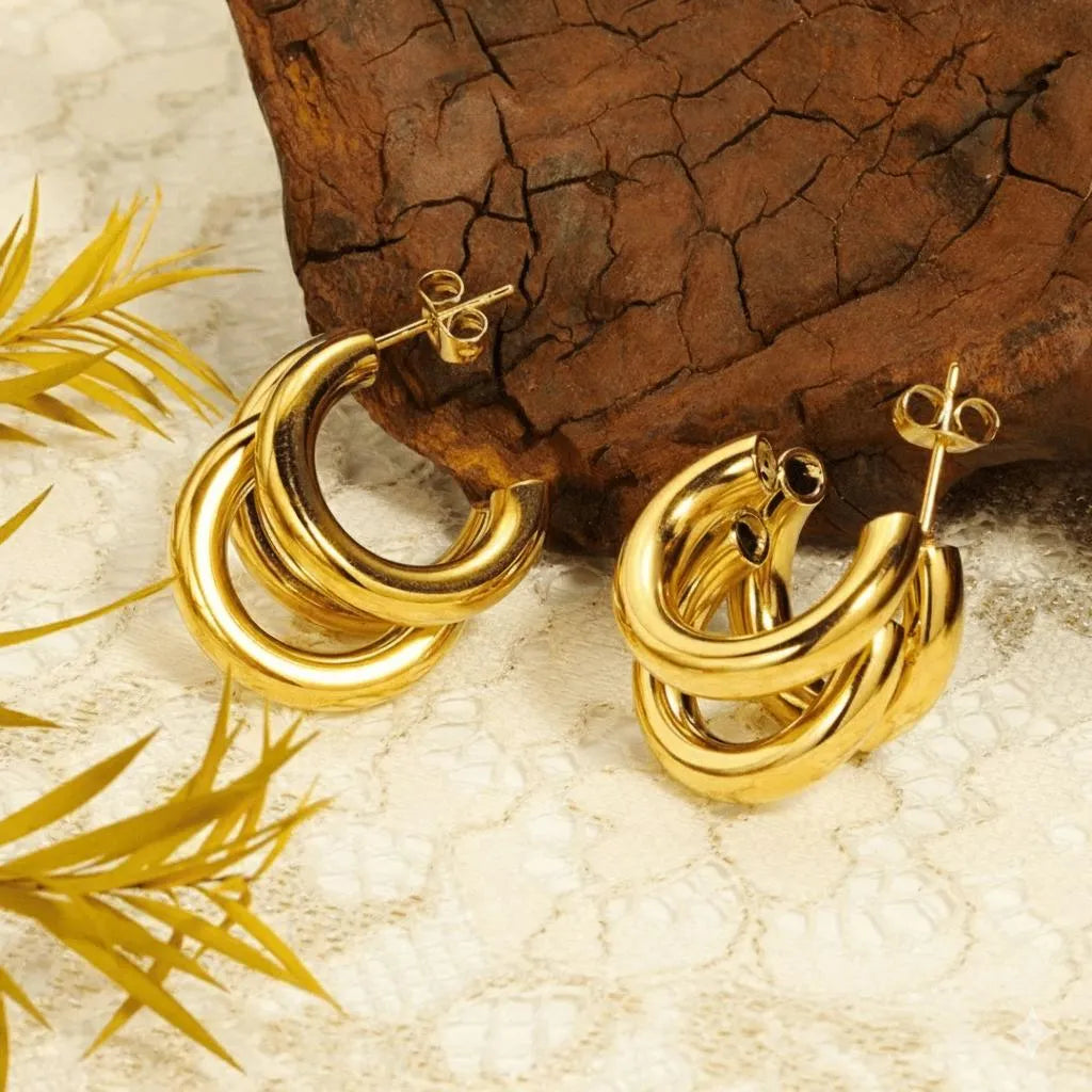 Golden three-layer Korean style hoop earrings for women made of lightweight alloy for casual and festive jewelry wear.